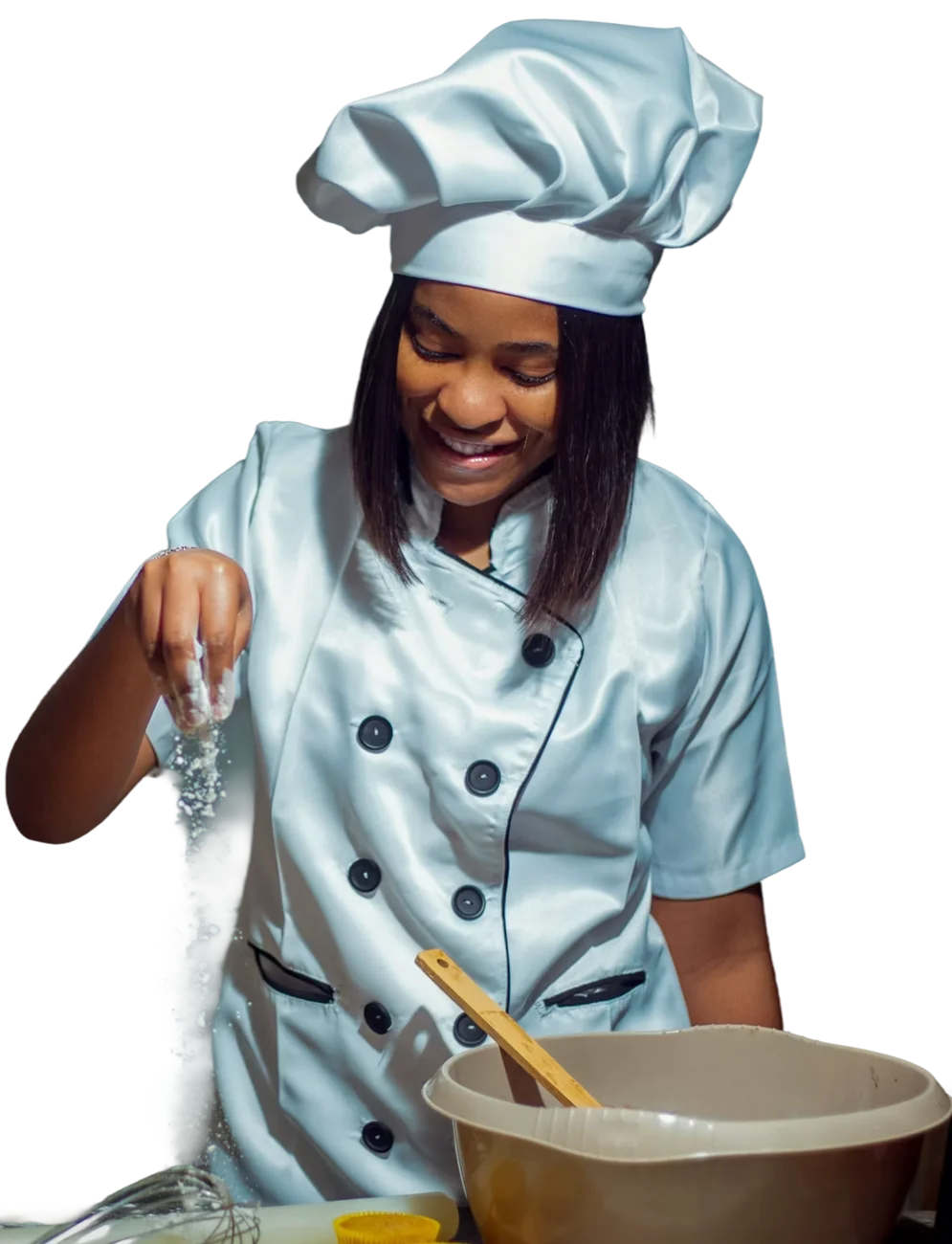 Our cook sprinkling seasoning into a mixing bowl