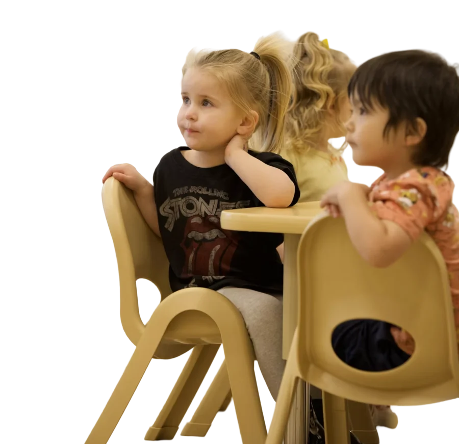 Two young children sitting together at a table