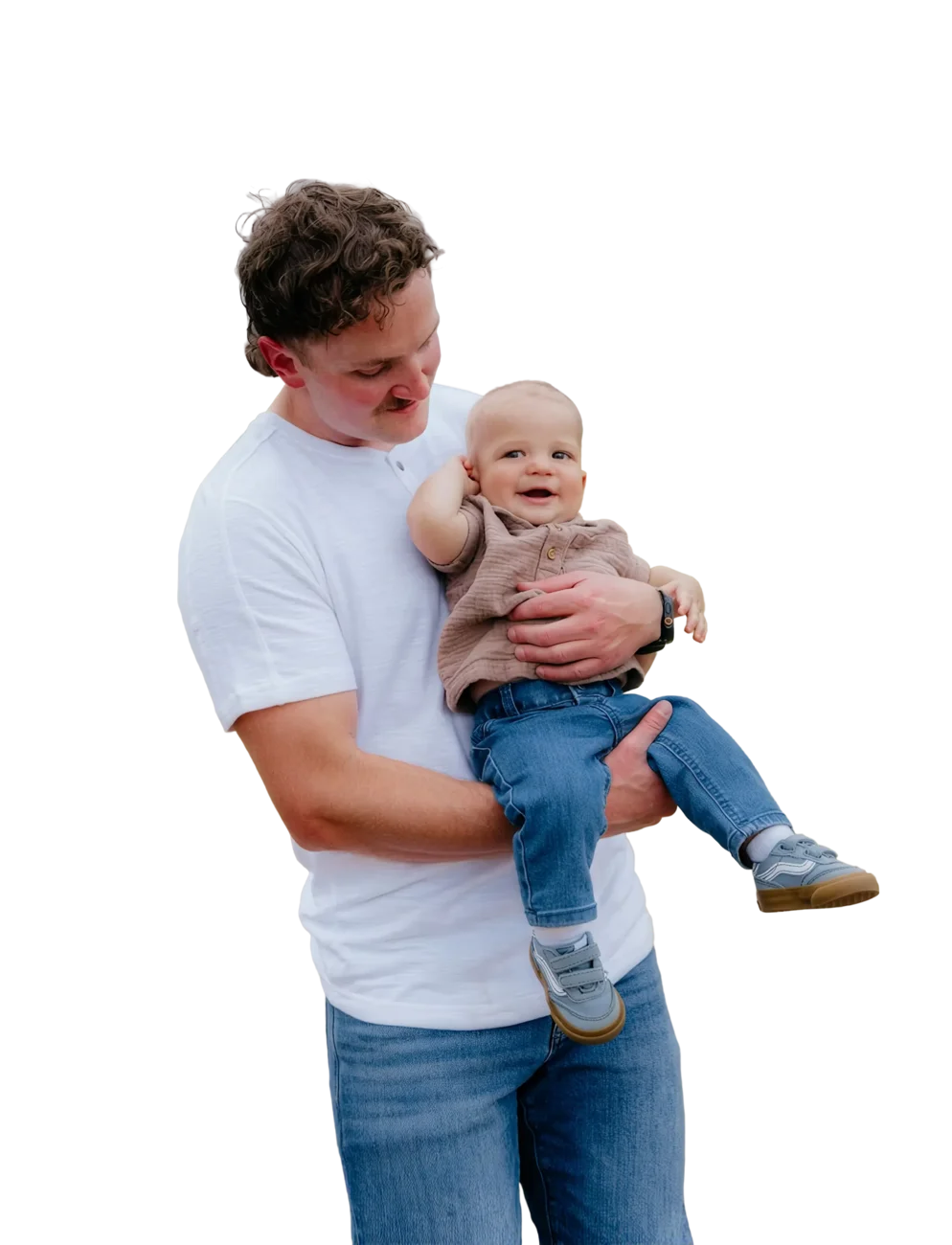 A smiling dad holding his baby